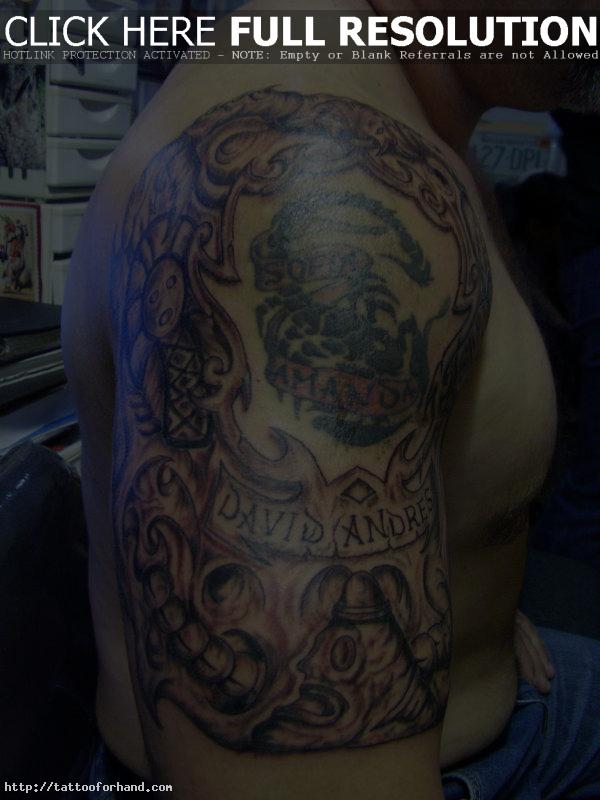 Biomechanical with taino symbols tattoo